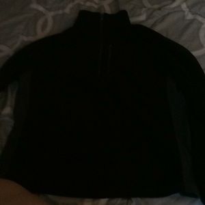 A black half zip up sweatshirt with a collar